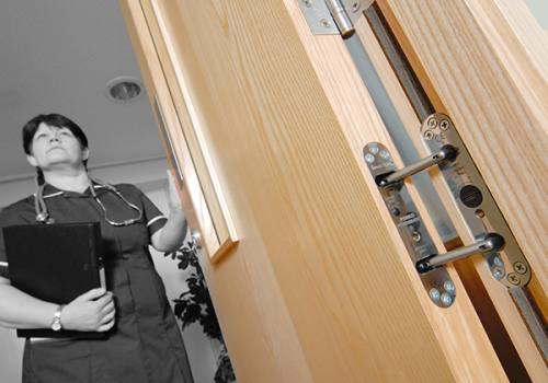 Powermatic controlled concealed door closer mental health psychiatric facilities anti-ligature healthcare hospital institutionalisation